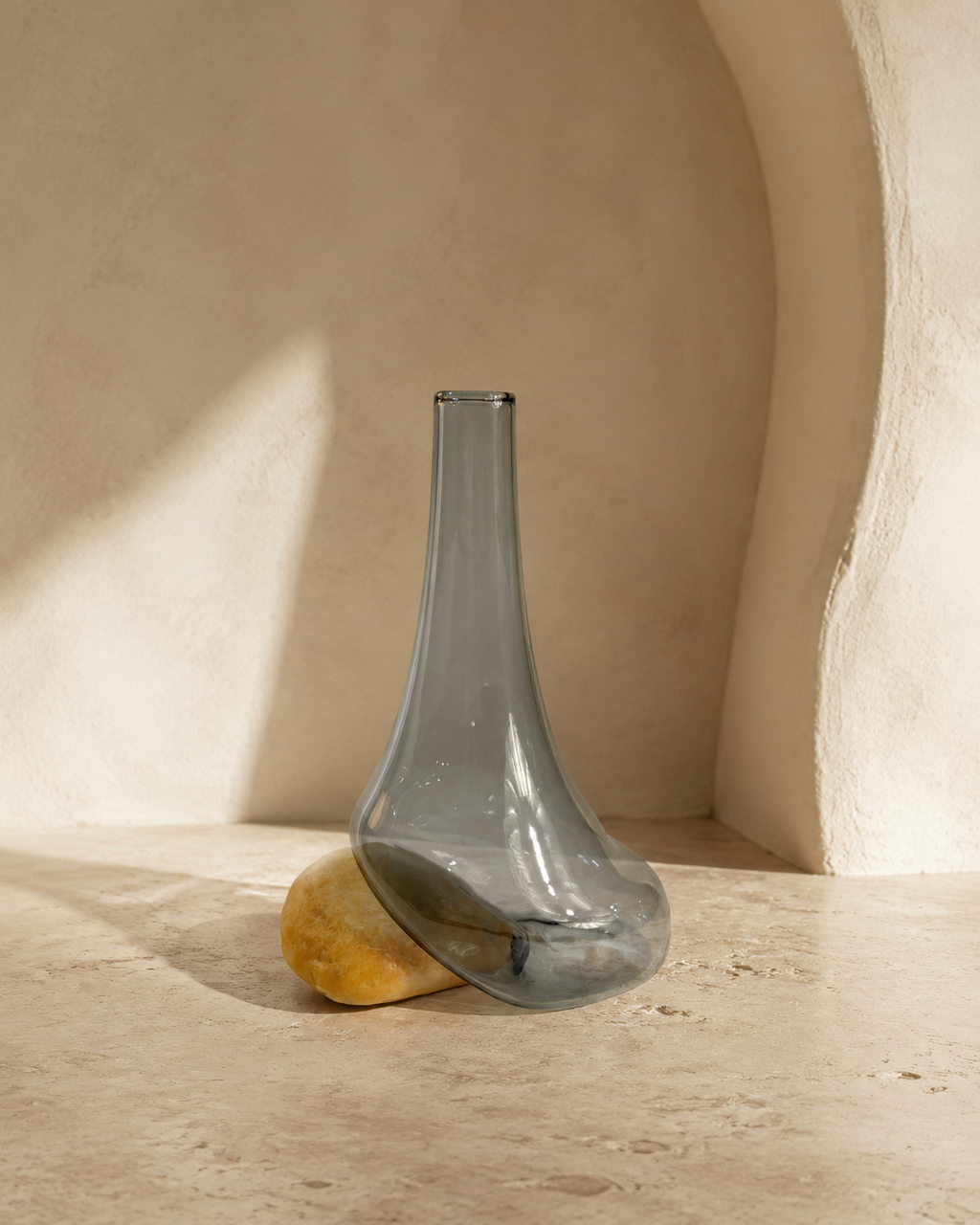 Stoneveil No. 003 one-of-one smoke-blue glass and ochre stone vase displayed empty