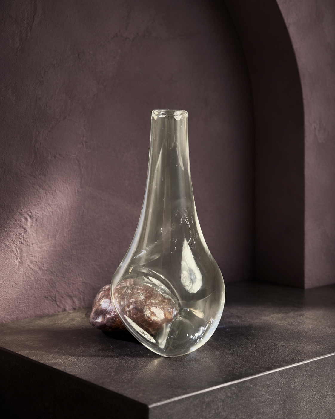 Stoneveil No. 006 one-of-one clear glass and mauve-pink stone vase displayed empty