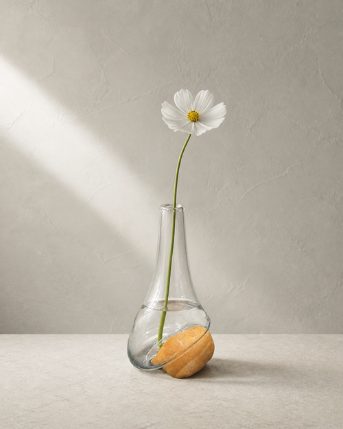 Stoneveil No. 001 one-of-one glass and ochre stone vase styled with a white cosmos