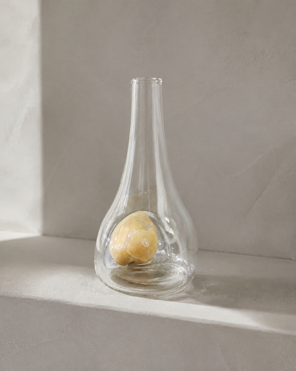 Alternate view of Stoneveil No. 005 clear glass vase paired with a pale ivory natural stone