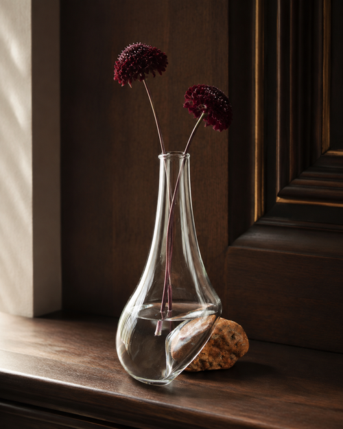 Stoneveil No. 004 clear glass and coral stone bud vase styled with burgundy scabiosa