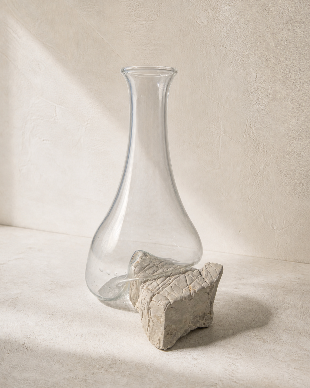 Side view showing the separate glass vessel and natural stone support