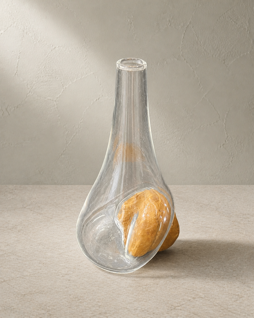 Side view showing the asymmetric glass form and exposed ochre stone of Stoneveil No. 001