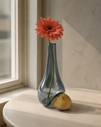 Stoneveil No. 007 smoke-blue glass and golden stone vase with a coral gerbera