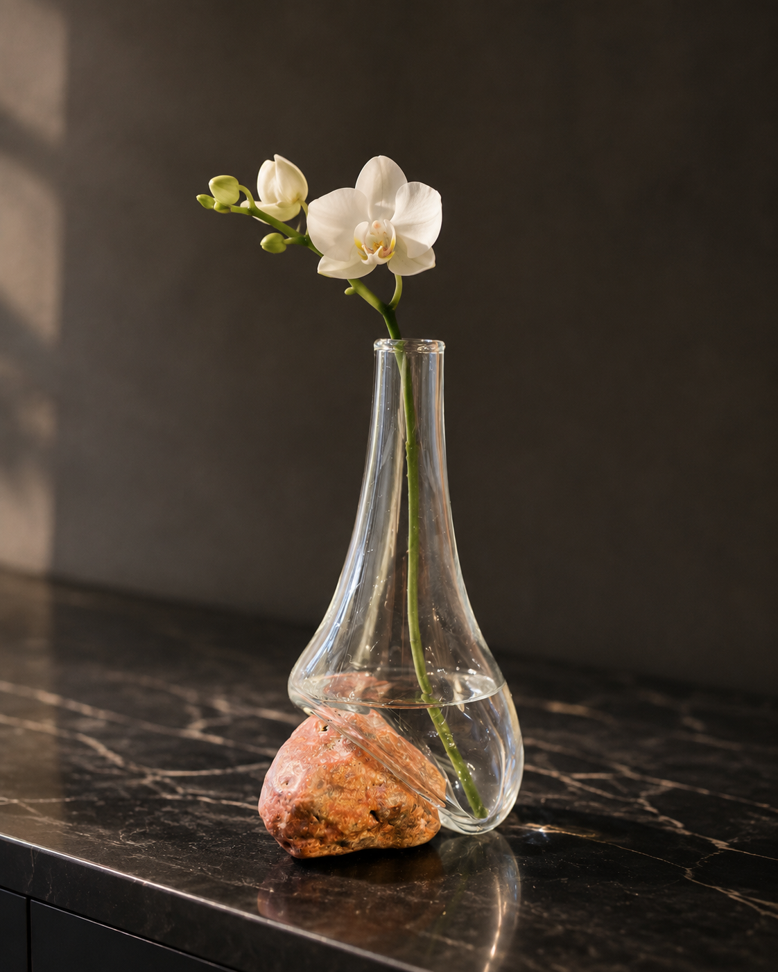Stoneveil No. 004 clear glass and coral stone vase with a white miniature orchid
