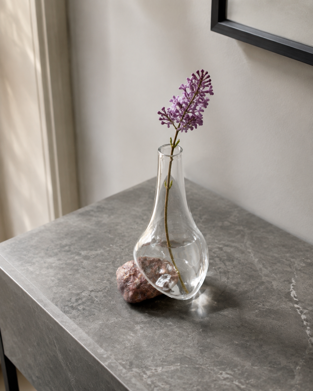 Stoneveil No. 006 one-of-one bud vase styled with lilac on a gray marble console