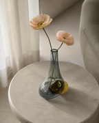 Stoneveil No. 003 one-of-one bud vase styled with blush anemones in a quiet reading nook