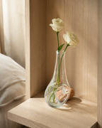 Stoneveil No. 004 one-of-one bud vase with cream lisianthus in a pale oak niche